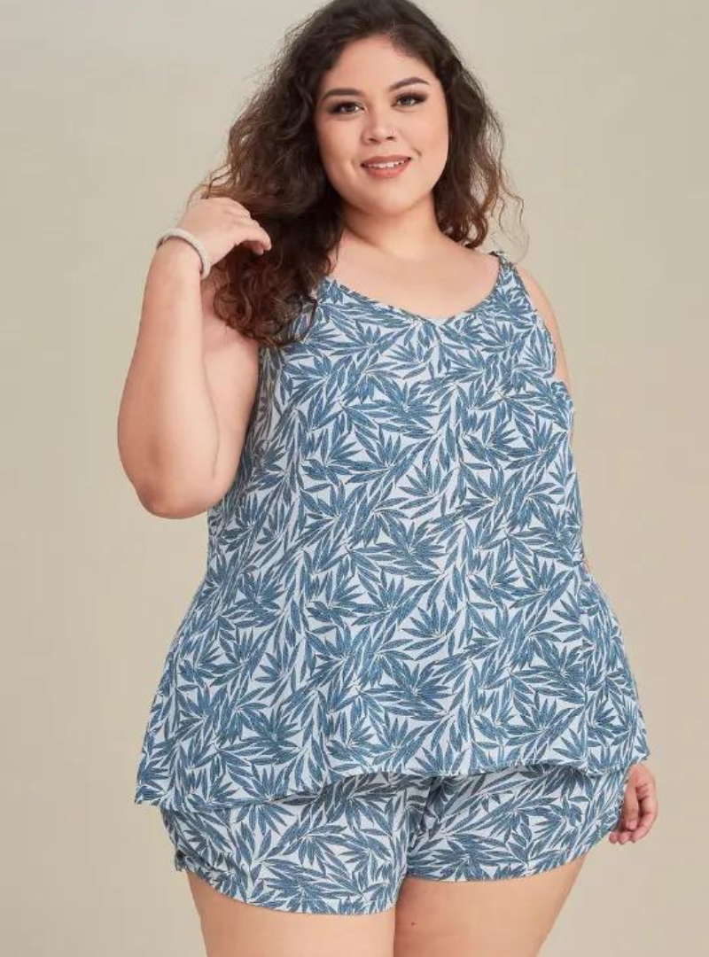 A woman dressed in Tropical Blue Printed Rayon Spaghetti Top