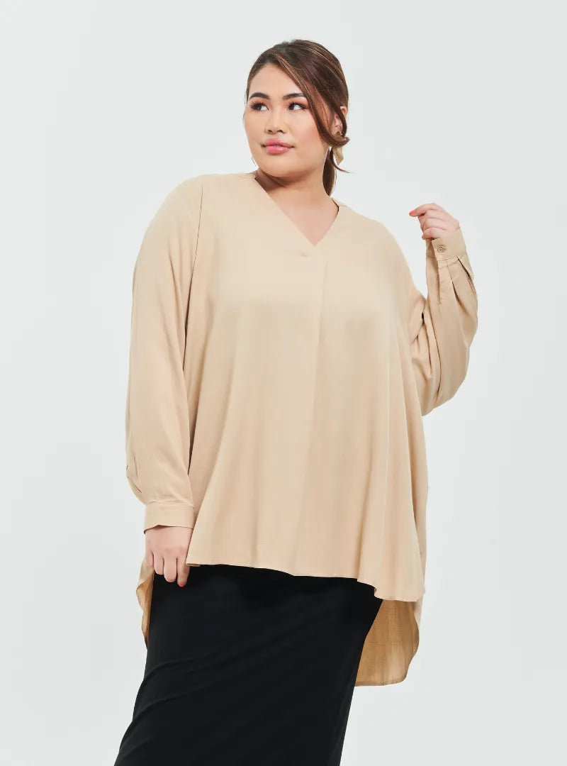 A woman dressed in Sand Mandarin Collar Oversized Shirt