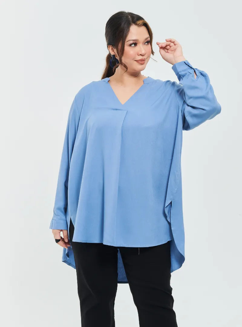A woman dressed in Stone Blue Mandarin Collar Oversized Shirt