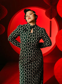 A woman dressed in Black Cheongsam Eyelet