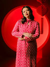 A woman dressed in Pink Doll Cheongsam Eyelet