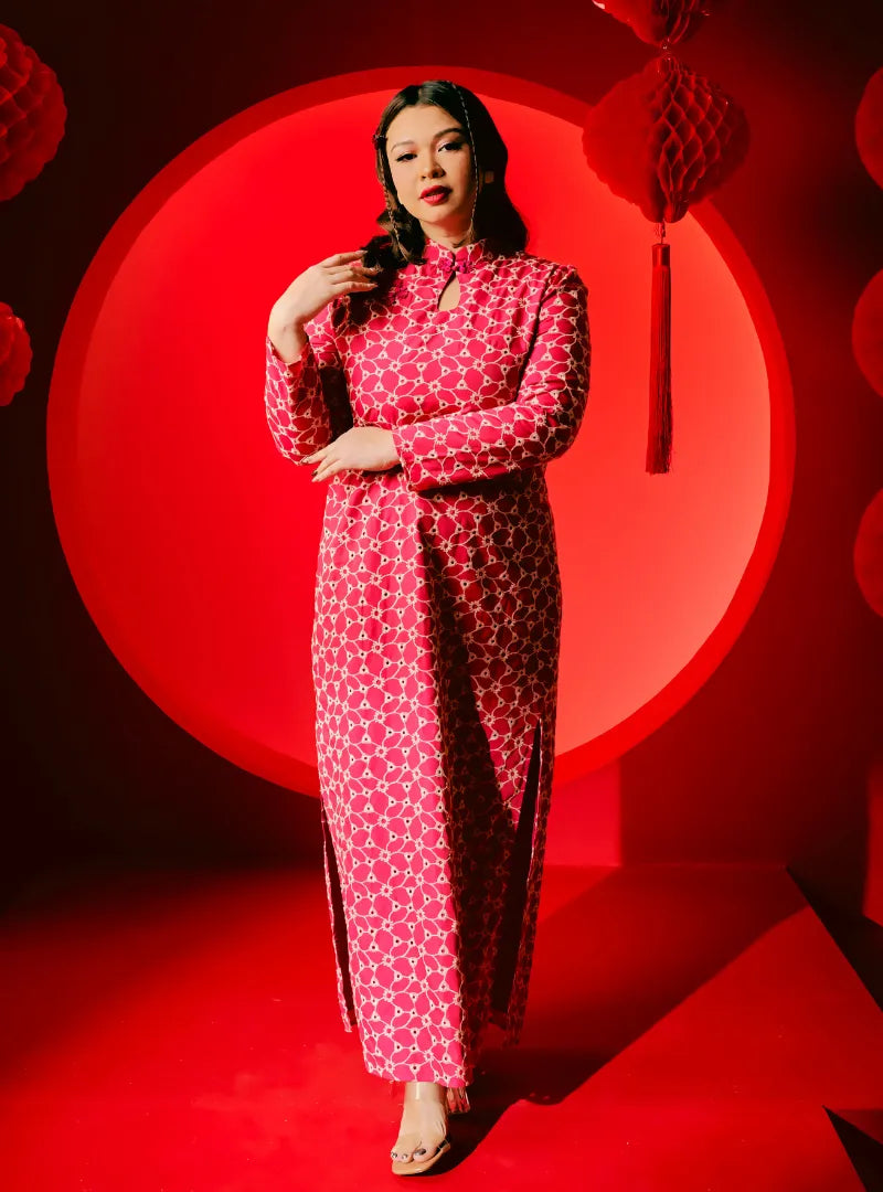 A woman dressed in Pink Doll Cheongsam Eyelet