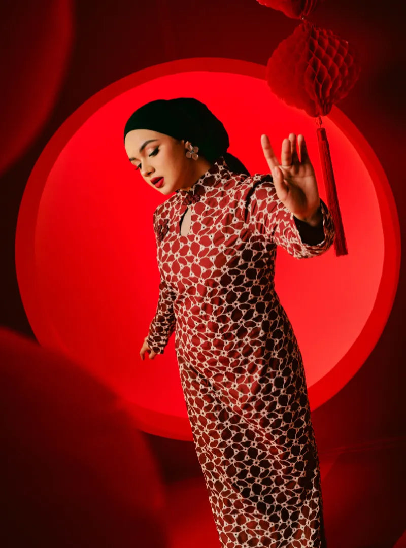 A woman dressed in Scarlet Red Cheongsam Eyelet