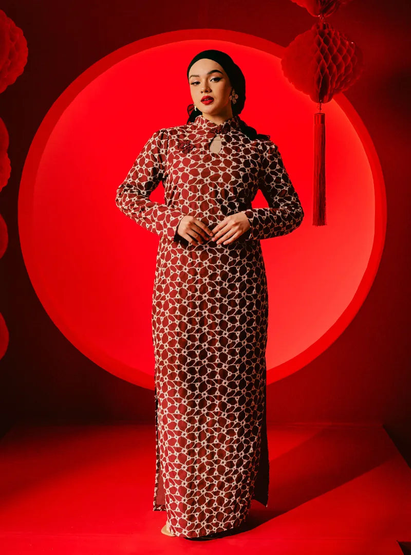 A woman dressed in Scarlet Red Cheongsam Eyelet