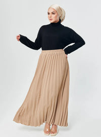 A woman wearing Sand  Basic Pleated Skirt