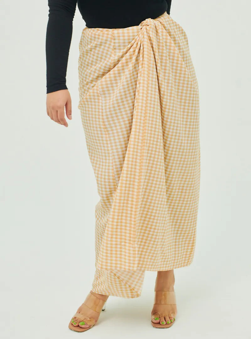 A woman wearing Sand Instant Checked Pario Wrap Skirt Only