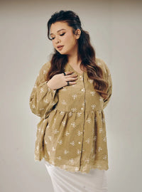 A woman dressed in Sand Tun Ava Embroidered Top