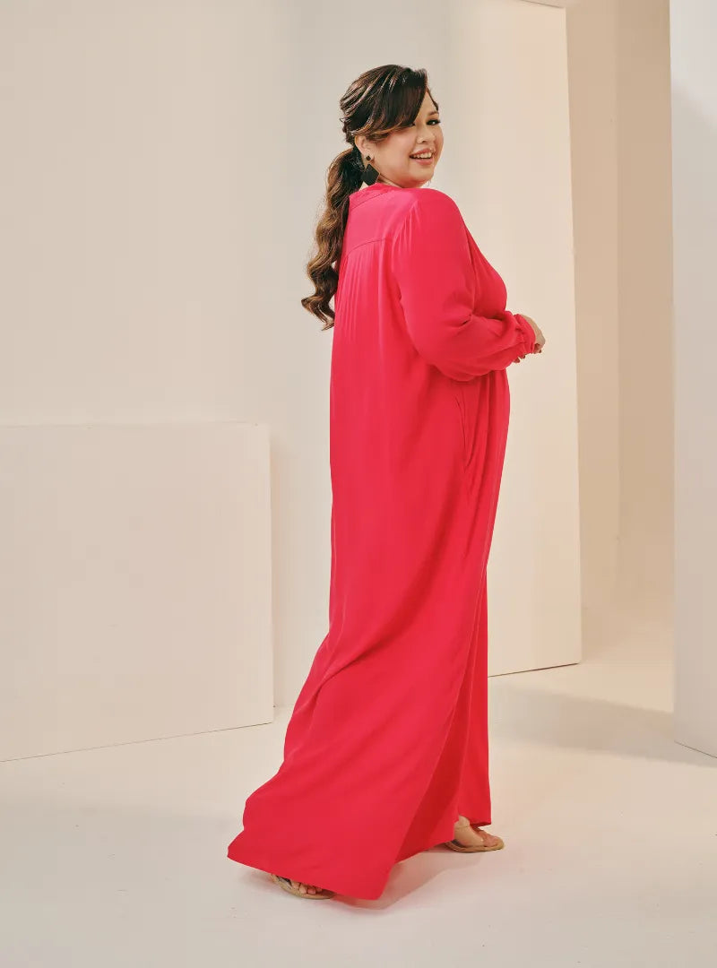 A woman dressed in Hot Pink Selsae Mandarin Collar Kaftan