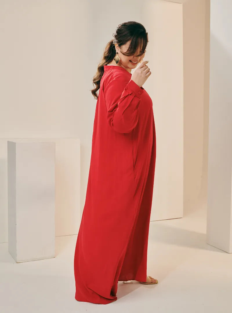 A woman dressed in Hot Red Selsae Mandarin Collar Kaftan