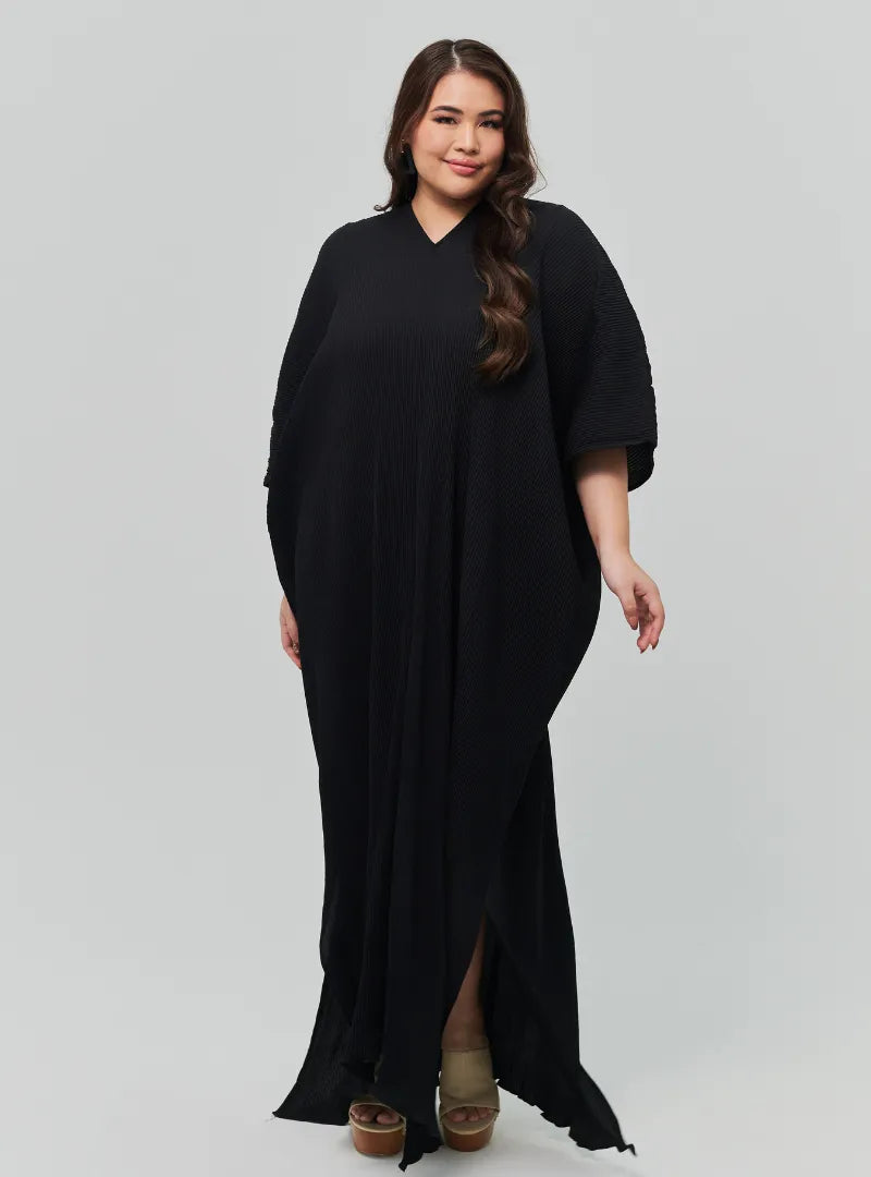 A woman Dressed in Black Signature Pleated Kaftan