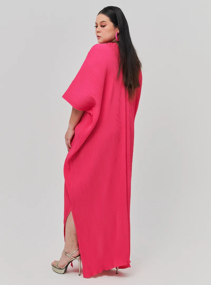 A woman Dressed in Hot Pink Signature Pleated Kaftan