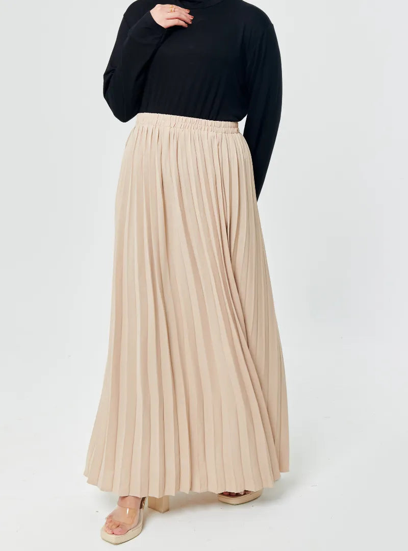 A woman wearing Skin  Basic Pleated Skirt