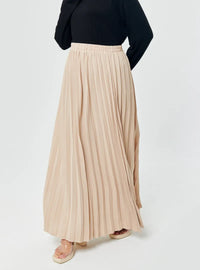 A woman wearing Skin  Basic Pleated Skirt