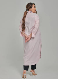 A woman dressed in Soft Pink Longline Oversized Cotton Shirt Dress