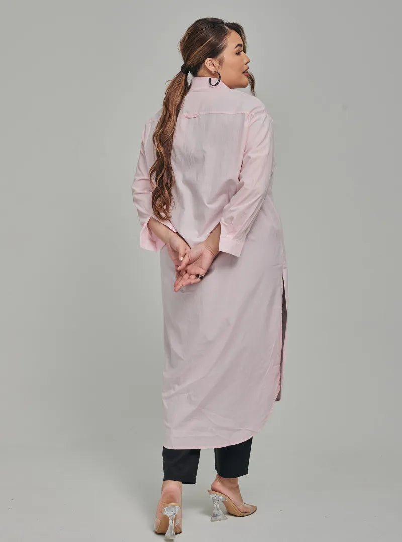 A woman dressed in Soft Pink Longline Oversized Cotton Shirt Dress