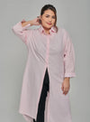 A woman dressed in Soft Pink Longline Oversized Cotton Shirt Dress