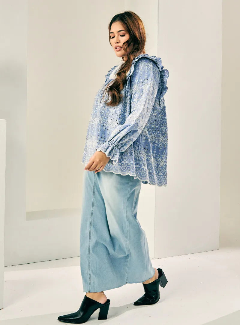 A woman dressed in Stone Blue Miza Cotton Broderies Eyelet Top