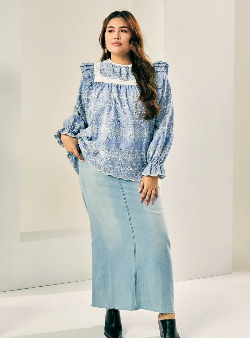 A woman dressed in Stone Blue Miza Cotton Broderies Eyelet Top