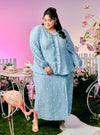  A woman dressed in Stone Blue Tun Anisah Kebaya Kurung