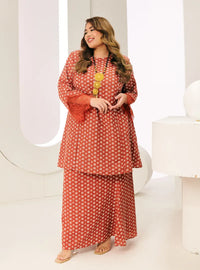 A woman dressed in Tangerine Tun Maryam Eyelet Kurung