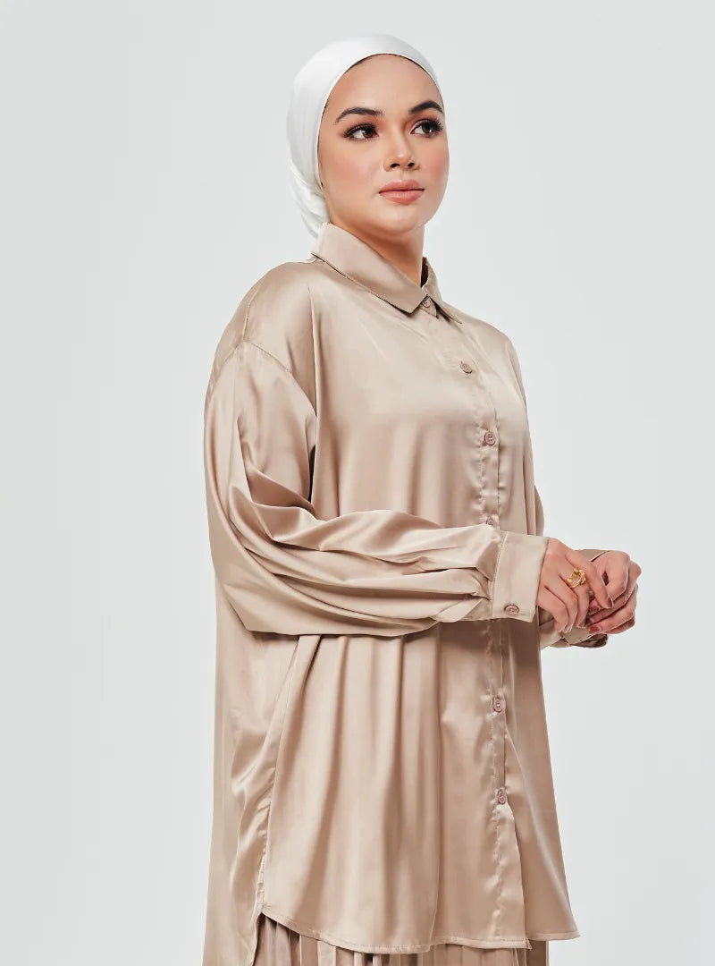 A woman dressed in Thunder Dropped Shoulder Satin Shirt