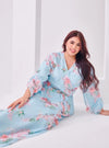 A woman dressed in Tifanny Tun Hamidah Chiffon Wrap Kurung