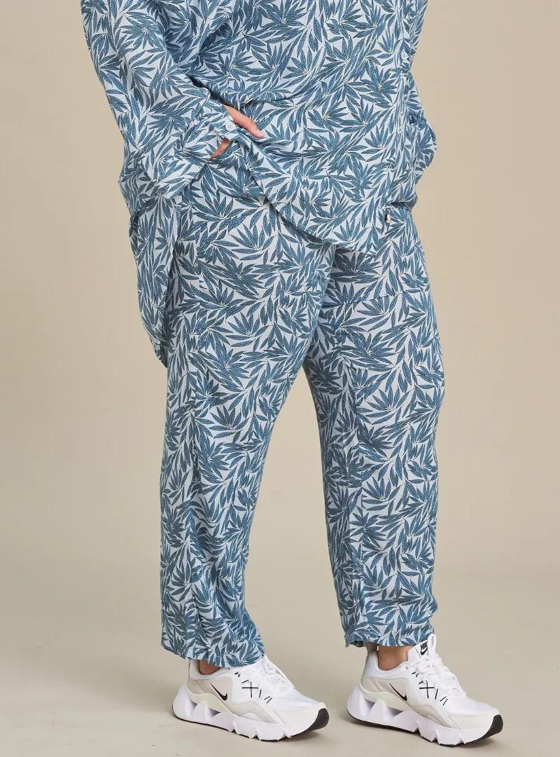 A woman wearing Tropical Blue Lounge Pants