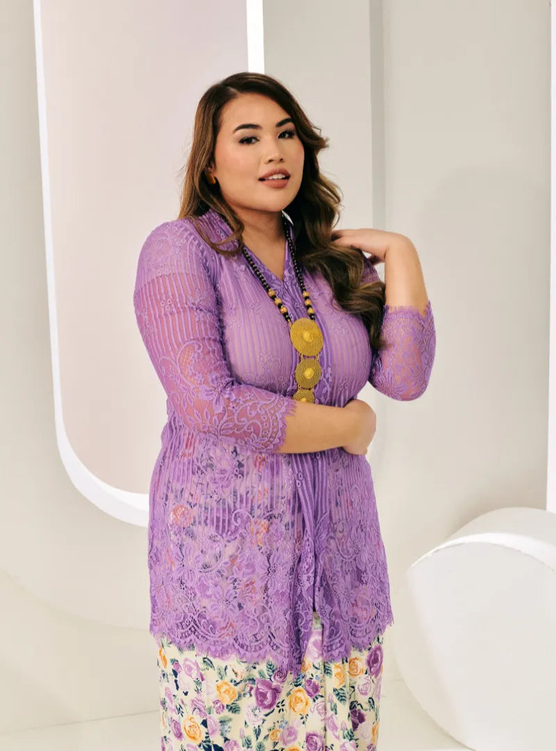 A woman dressed in Tulip Purple Tun Basirah Kebaya Lace Nyonya