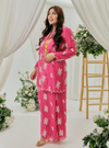 A woman dressed in Pink Doll Tun Saloma Klasik Kebaya Kurung