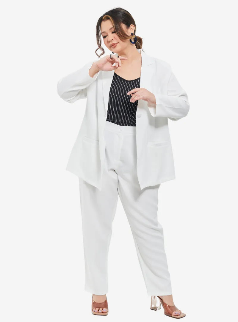 A woman dressed in White Oversized Blazer