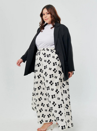 A woman wearing White Paw Printed Cotton Maxi Skirt