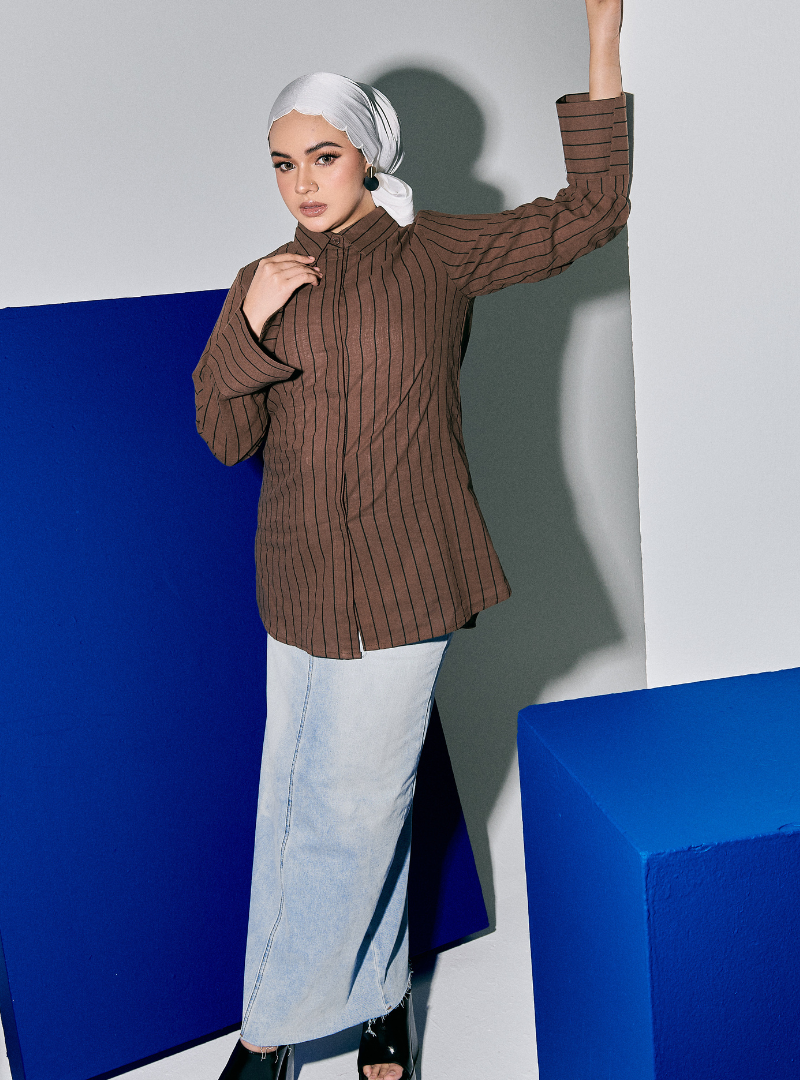 A woman wearing Walnut Janiper Striped Shirt