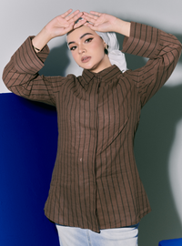 A woman wearing Walnut Janiper Striped Shirt