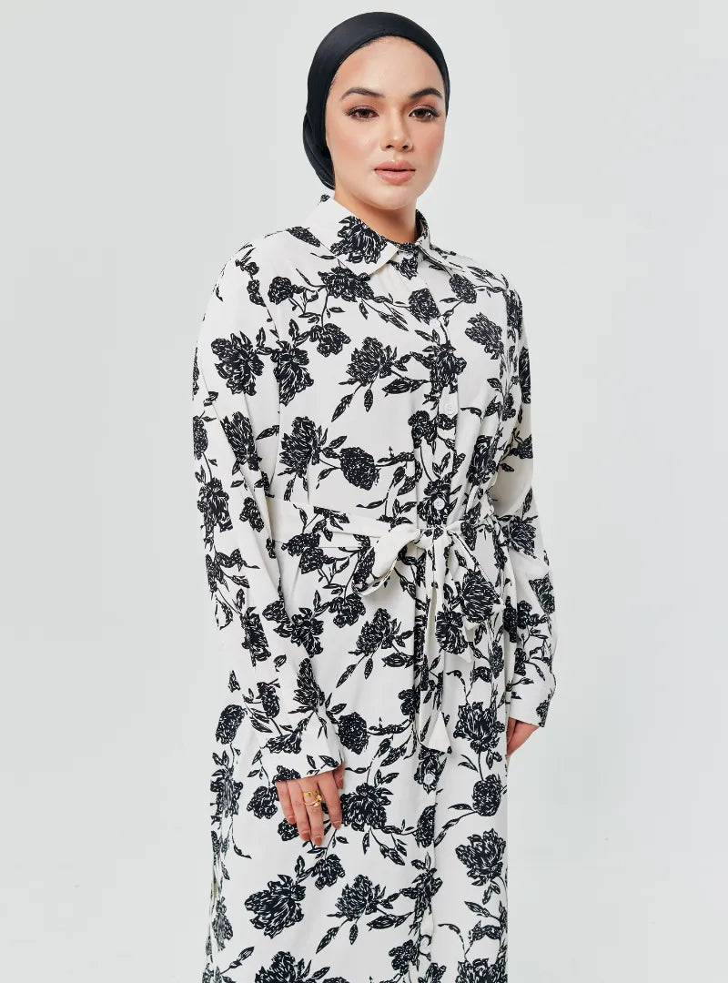 A woman dressed in White Chrysanthemum Longline Printed Shirt Dress