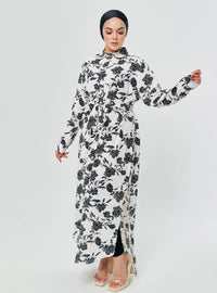 A woman dressed in White Chrysanthemum Longline Printed Shirt Dress