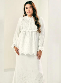 A woman dressed in White Ezzah Eyelet Doll Top