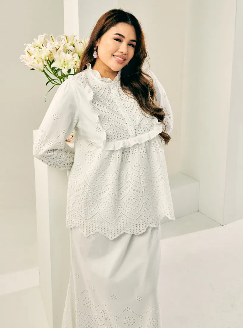 A woman dressed in White Ezzah Eyelet Doll Top