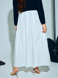 A woman wearing White Harper Poplin Skirt