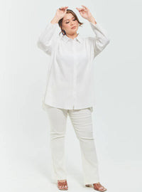 A woman dressed in White Textured Shirt