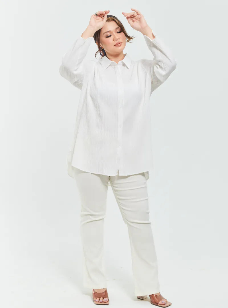 A woman dressed in White Textured Shirt