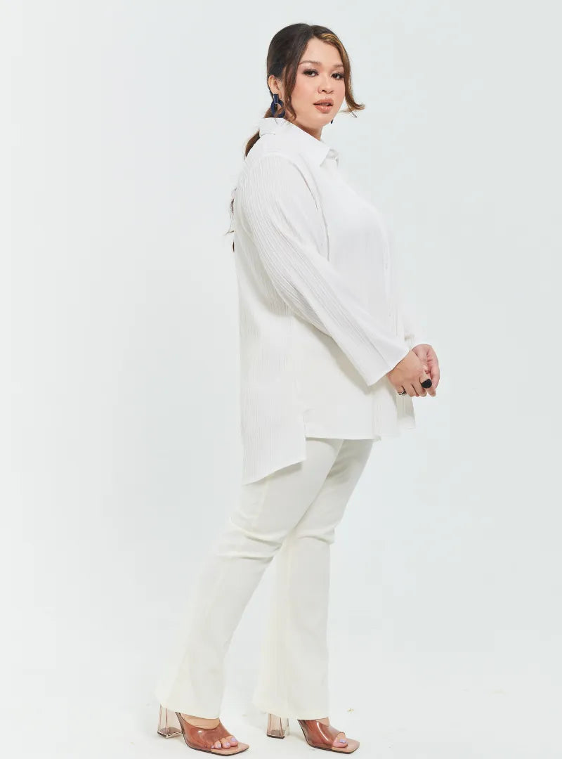 A woman dressed in White Textured Shirt