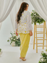 A woman dressed in Yellow Daisy Tun Jaeda Kebaya Nyonya Kurung