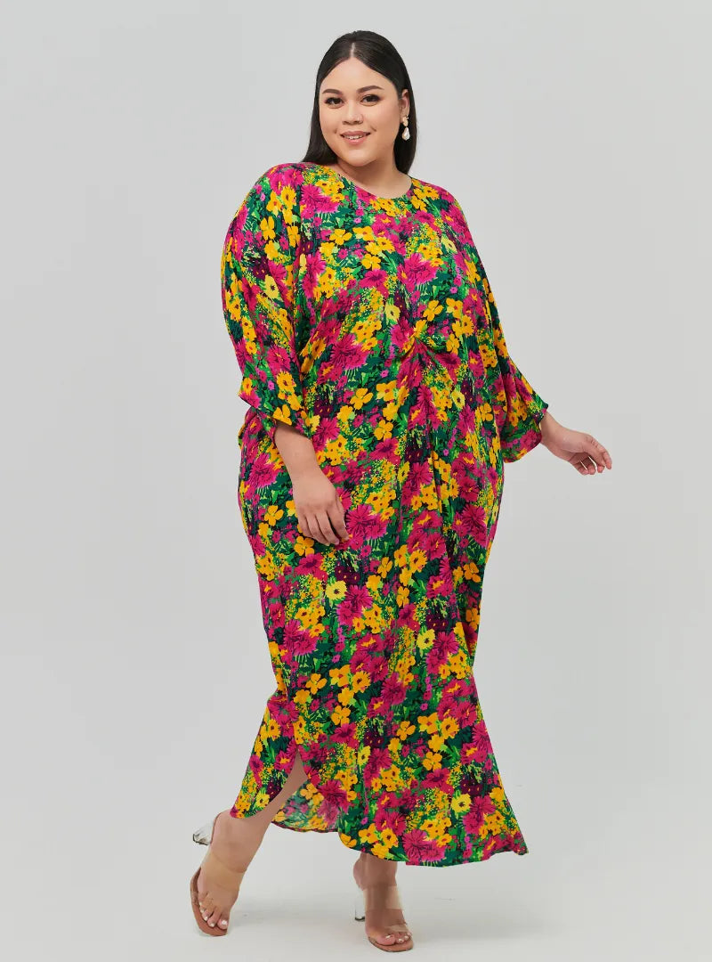 A woman dressed in Yellow Taman Essential Front Knot Kaftan