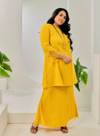 A woman dressed Yellow Tun Melur Dotted Kurung Pahang-