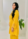 A woman dressed Yellow Tun Melur Dotted Kurung Pahang-