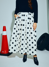 A woman wearing Black Polka Dotted